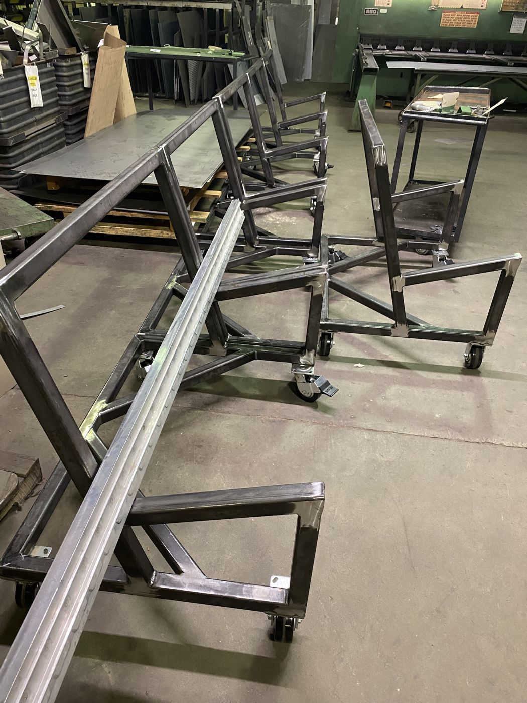 A row of welded steel tube frame carts in the shop