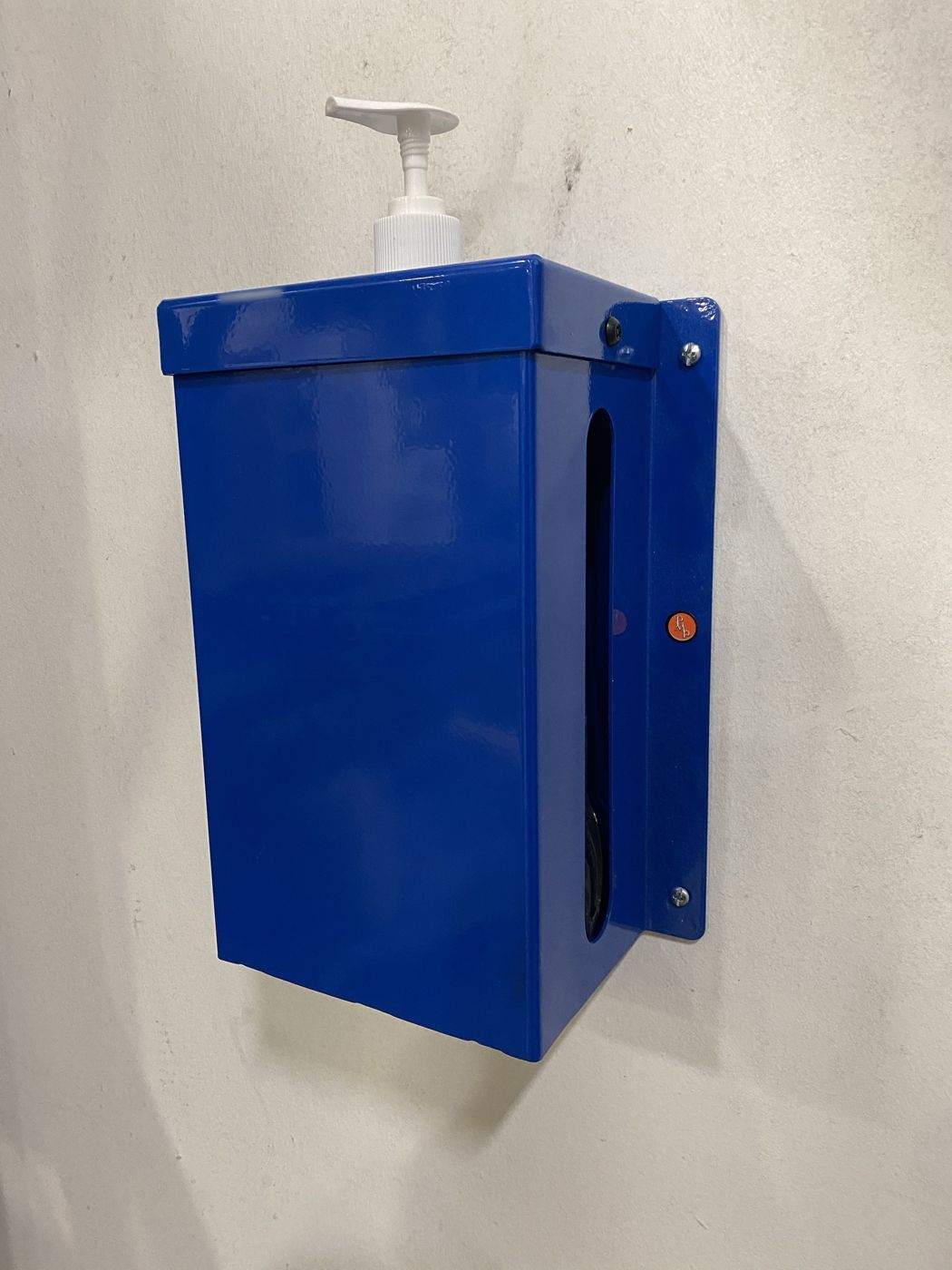 A blue powder-coated dispenser box mounted on a wall